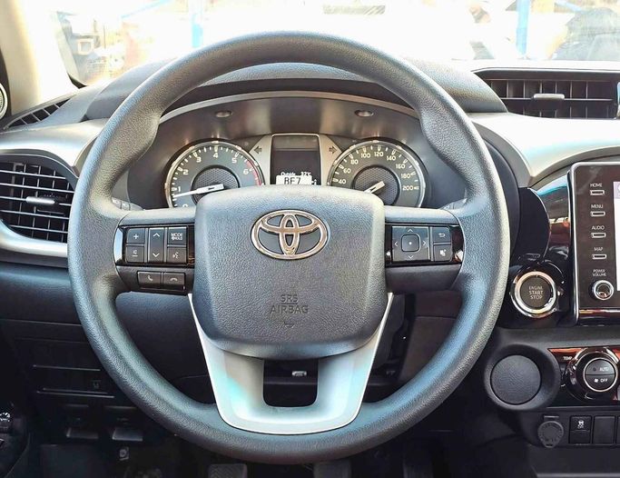 New Toyota Hilux VIII Facelift 2, 2.7 l, 2024 in Dubai by SK Motors, White color. GCC Specs | AUTO.AE