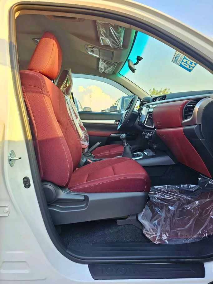 New Toyota Hilux VIII Facelift 2, 2.7 l, 2024 in Dubai by SK Motors, White color. GCC Specs | AUTO.AE