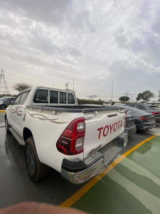 New Toyota Hilux VIII Facelift, 2.7 l, 2025 in Dubai by Soltan Auto, White color. GCC Specs | AUTO.AE