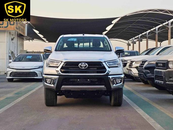 New Toyota Hilux VIII Facelift, 2.4 l, 2025 in Dubai by SK Motors, White color. GCC Specs | AUTO.AE