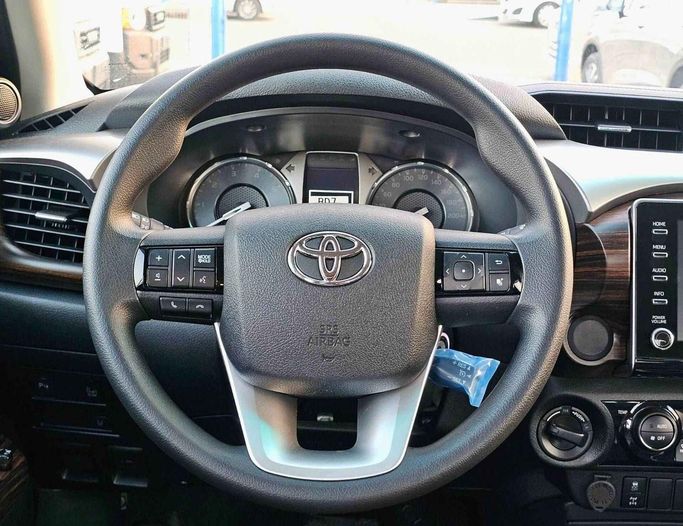 New Toyota Hilux VIII Facelift, 2.4 l, 2025 in Dubai by SK Motors, White color. GCC Specs | AUTO.AE