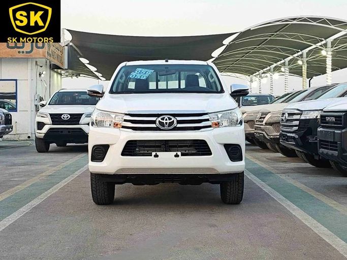 New Toyota Hilux VIII Facelift, 2.4 l, 2025 in Dubai by SK Motors, White color. GCC Specs | AUTO.AE