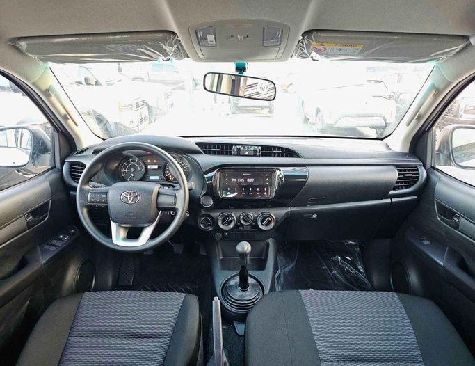 New Toyota Hilux VIII Facelift, 2.4 l, 2025 in Dubai by SK Motors, White color. GCC Specs | AUTO.AE