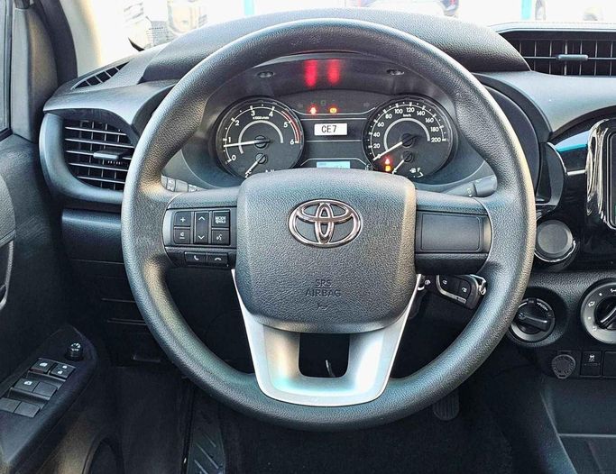 New Toyota Hilux VIII Facelift, 2.4 l, 2025 in Dubai by SK Motors, White color. GCC Specs | AUTO.AE