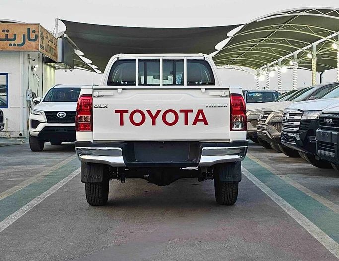 New Toyota Hilux VIII Facelift, 2.4 l, 2025 in Dubai by SK Motors, White color. GCC Specs | AUTO.AE