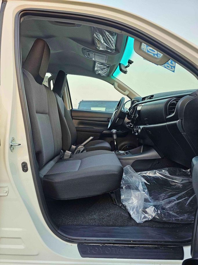 New Toyota Hilux VIII Facelift, 2.4 l, 2025 in Dubai by SK Motors, White color. GCC Specs | AUTO.AE