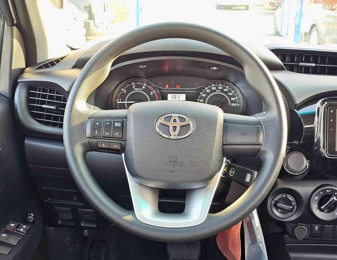 New Toyota Hilux VIII Facelift, 2.4 l, 2025 in Dubai by SK Motors, White color. GCC Specs | AUTO.AE