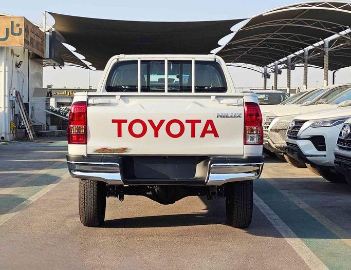 New Toyota Hilux VIII Facelift, 2.4 l, 2025 in Dubai by SK Motors, White color. GCC Specs | AUTO.AE