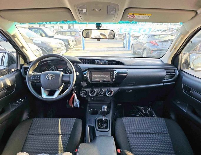 New Toyota Hilux VIII Facelift, 2.4 l, 2025 in Dubai by SK Motors, White color. GCC Specs | AUTO.AE