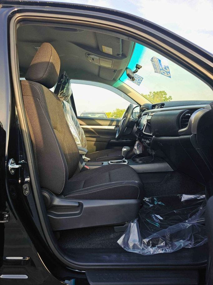 New Toyota Hilux VIII Facelift, 2.7 l, 2025 in Dubai by SK Motors, Black color. GCC Specs | AUTO.AE