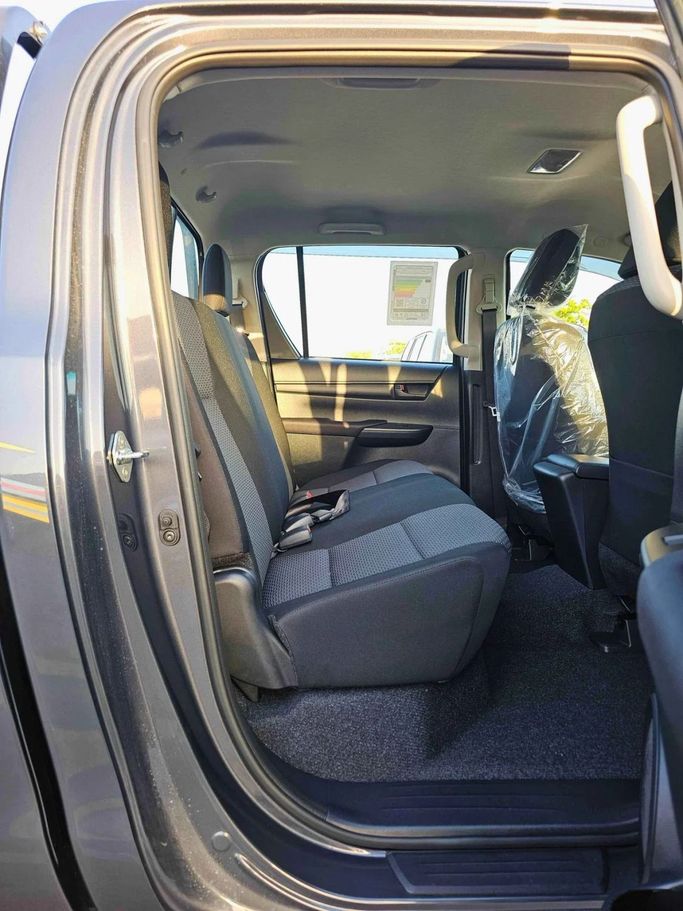 New Toyota Hilux VIII Facelift, 2.4 l, 2025 in Dubai by SK Motors, Grey color. GCC Specs | AUTO.AE