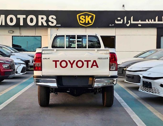 New Toyota Hilux VIII Facelift 2, 2.7 l, 2025 in Dubai by SK Motors, White color. GCC Specs | AUTO.AE