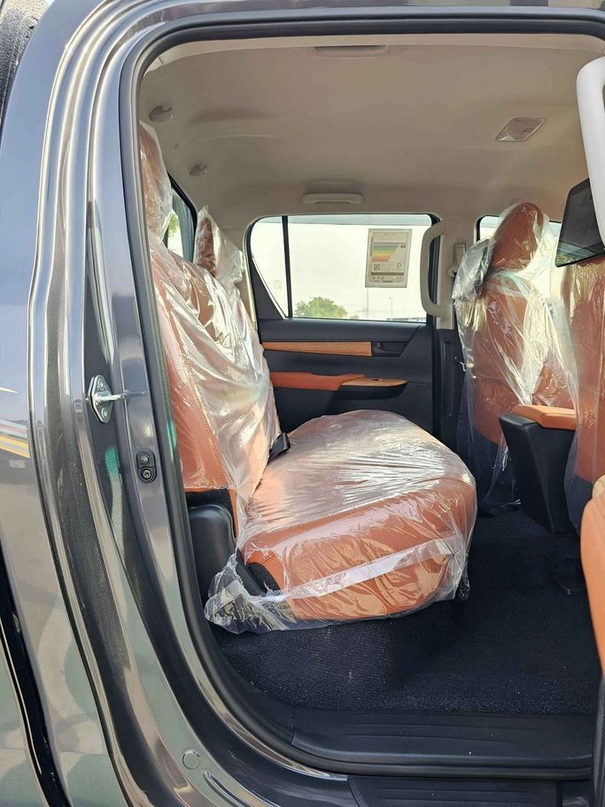 New Toyota Hilux VIII Facelift, 2.4 l, 2025 in Dubai by SK Motors, Grey color. GCC Specs | AUTO.AE