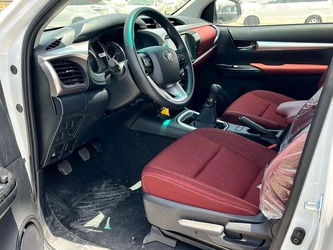 New Toyota Hilux VIII Facelift, 2.7 l, 2025 in Dubai by We Can Motors, White color. GCC Specs | AUTO.AE