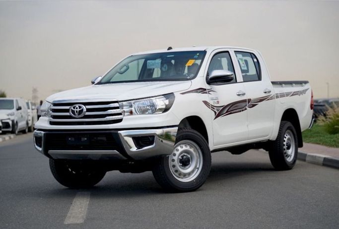 New Toyota Hilux Extra Cab VIII Facelift, 2.4 l, 2025 in Dubai by Pegasus Automobile, White color. GCC Specs | AUTO.AE