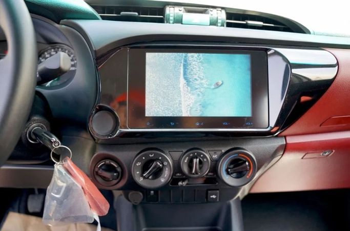 New Toyota Hilux Extra Cab VIII Facelift, 2.4 l, 2025 in Dubai by Pegasus Automobile, White color. GCC Specs | AUTO.AE