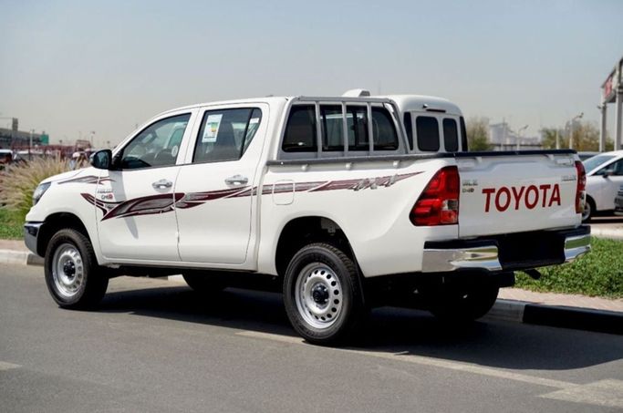 New Toyota Hilux Extra Cab VIII Facelift, 2.4 l, 2025 in Dubai by Pegasus Automobile, White color. GCC Specs | AUTO.AE