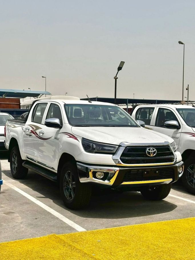 New Toyota Hilux Extra Cab VIII Facelift, 2.8 l, 2025 in Dubai by Pegasus Automobile, White color. GCC Specs | AUTO.AE