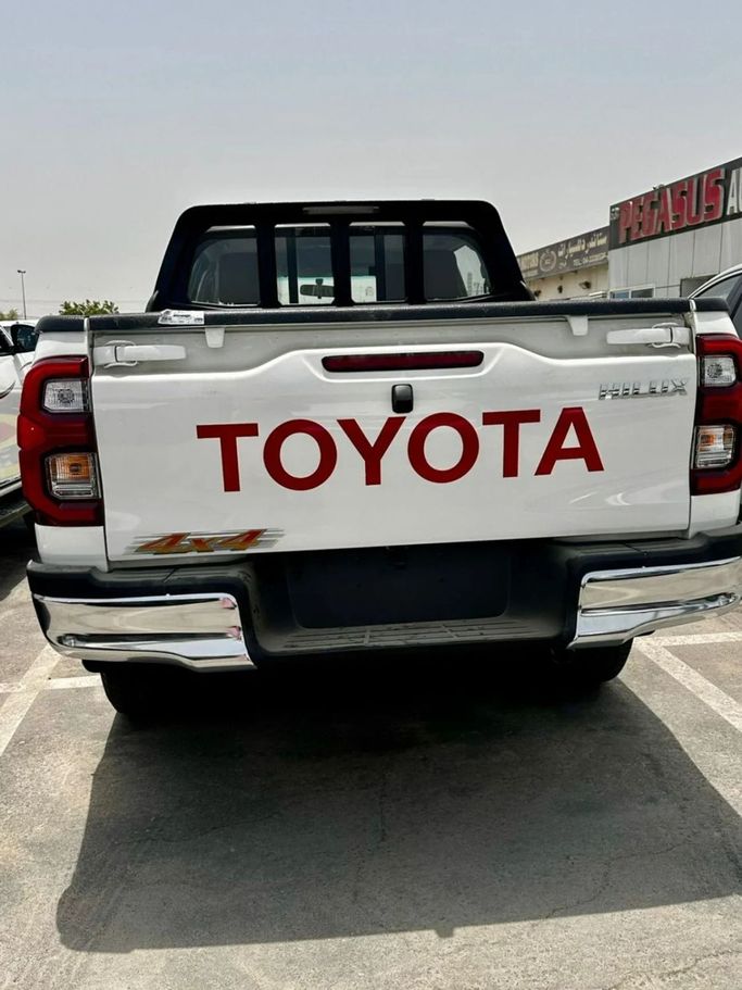 New Toyota Hilux Extra Cab VIII Facelift, 2.8 l, 2025 in Dubai by Pegasus Automobile, White color. GCC Specs | AUTO.AE