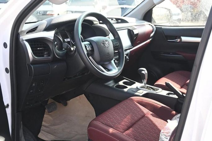 New Toyota Hilux VIII, 2.4 l, 2025 in Dubai by World Center Motors FZE, White color. GCC Specs | AUTO.AE
