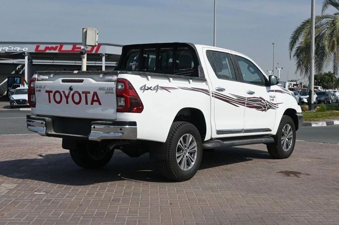New Toyota Hilux VIII, 2.4 l, 2025 in Dubai by World Center Motors FZE, White color. GCC Specs | AUTO.AE