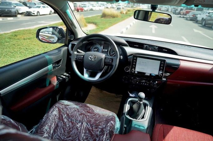 New Toyota Hilux VIII, 2.7 l, 2025 in Dubai by World Center Motors FZE, White color. GCC Specs | AUTO.AE