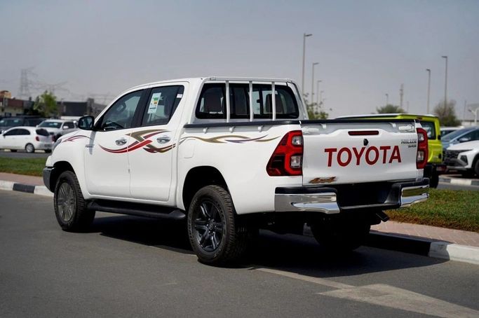 New Toyota Hilux VIII, 2.7 l, 2025 in Dubai by World Center Motors FZE, White color. GCC Specs | AUTO.AE