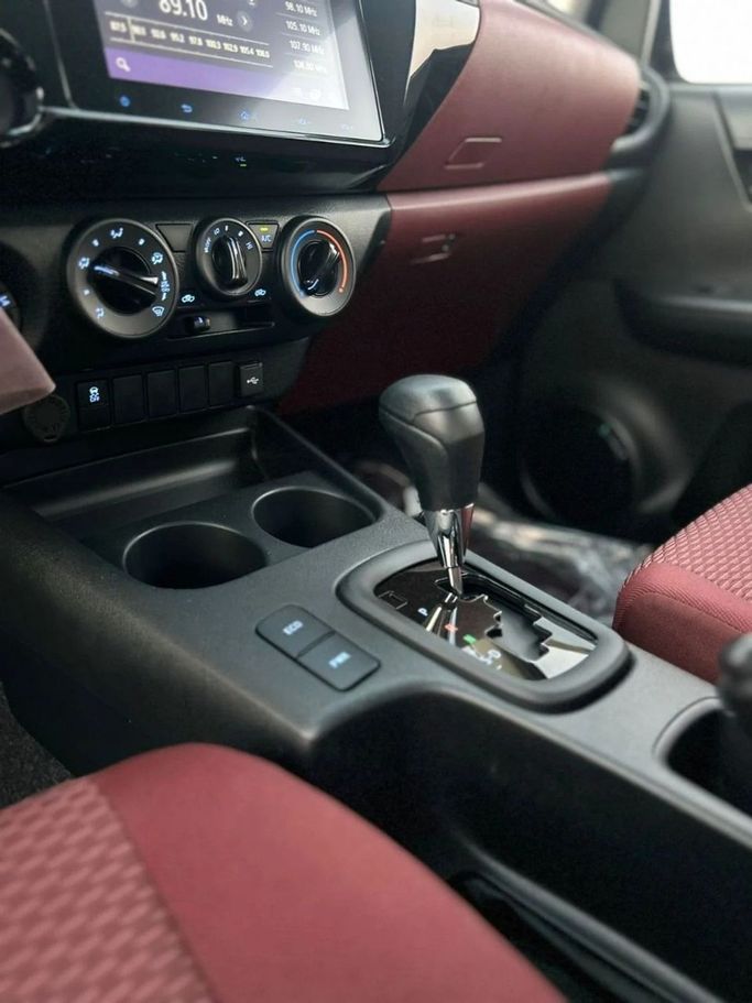 New Toyota Hilux VIII, 2.7 l, 2025 in Dubai by World Center Motors FZE, White color. GCC Specs | AUTO.AE