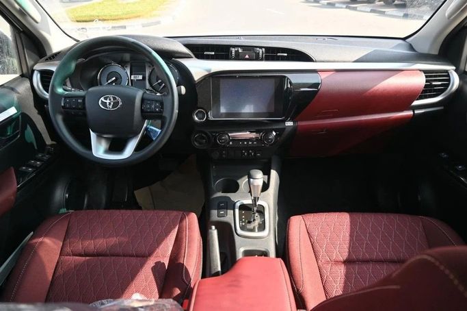 New Toyota Hilux VIII, 2.4 l, 2025 in Dubai by World Center Motors FZE, White color. GCC Specs | AUTO.AE