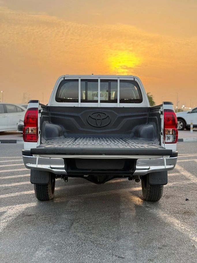 New Toyota Hilux VIII, 2.4 l, 2025 in Dubai by World Center Motors FZE, White color. GCC Specs | AUTO.AE