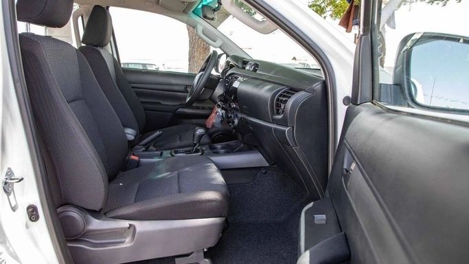 New Toyota Hilux VIII, 2.4 l, 2025 in Dubai by World Center Motors FZE, White color. GCC Specs | AUTO.AE