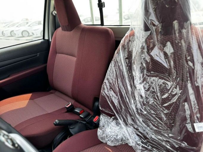 New Toyota Hilux VIII, 2.7 l, 2025 in Dubai by World Center Motors FZE, White color. GCC Specs | AUTO.AE