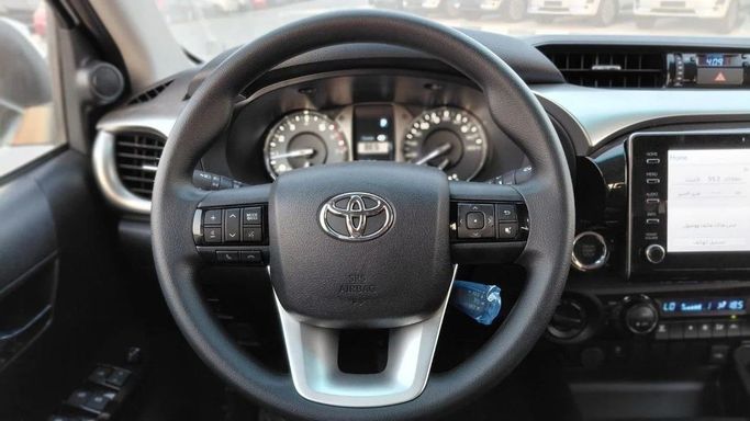 New Toyota Hilux VIII, 2.7 l, 2025 in Dubai by World Center Motors FZE, White color. GCC Specs | AUTO.AE