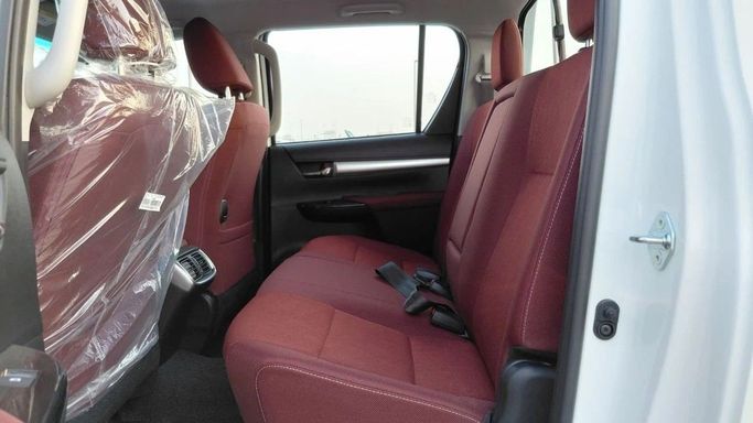 New Toyota Hilux VIII, 2.7 l, 2025 in Dubai by World Center Motors FZE, White color. GCC Specs | AUTO.AE