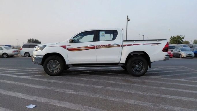 New Toyota Hilux VIII, 2.7 l, 2025 in Dubai by World Center Motors FZE, White color. GCC Specs | AUTO.AE