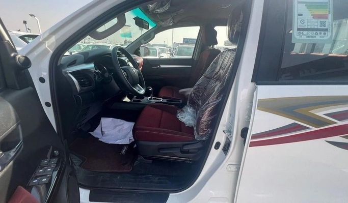New Toyota Hilux VIII, 2.7 l, 2025 in Dubai by World Center Motors FZE, White color. GCC Specs | AUTO.AE