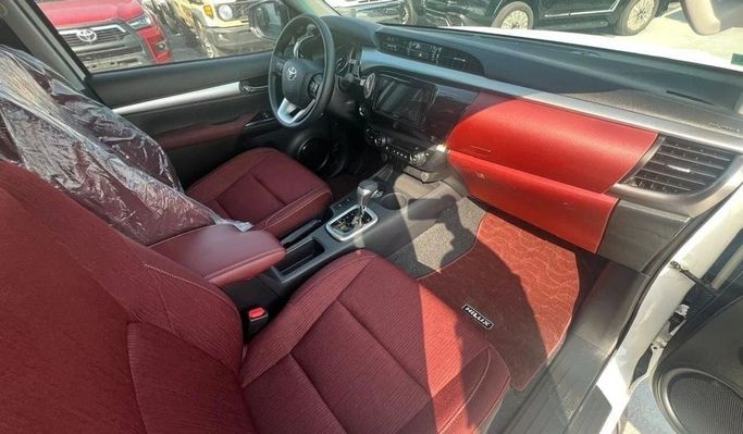 New Toyota Hilux VIII, 2.7 l, 2025 in Dubai by World Center Motors FZE, White color. GCC Specs | AUTO.AE