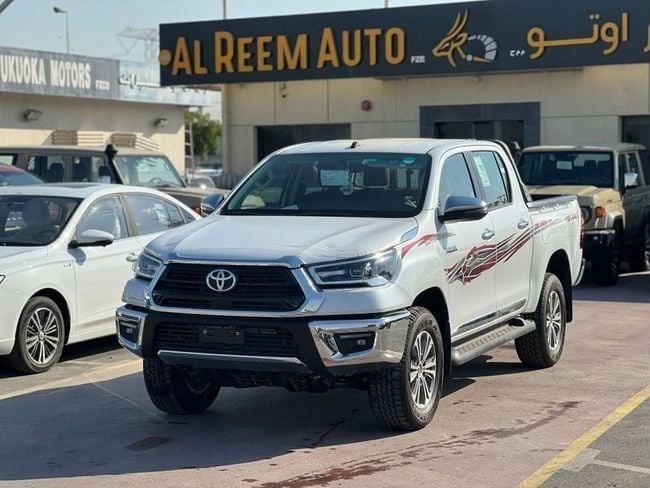 New Toyota Hilux VIII, 2.7 l, 2024 in Dubai by AL REEM AUTO, White color. GCC Specs | AUTO.AE