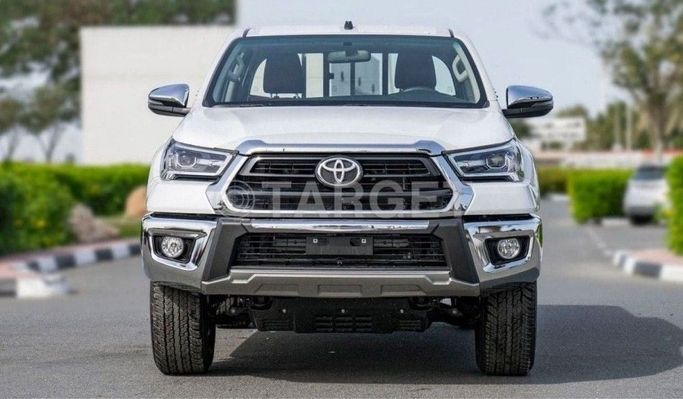 New Toyota Hilux VIII Facelift, 2.7 l, 2025 in Dubai by TARGET MOTORS FZE, White color. GCC Specs | AUTO.AE