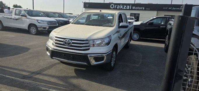 New Toyota Hilux VIII, 2.4 l, 2025 in Dubai by SALEM WALY AUTO FZE, White color. GCC Specs | AUTO.AE