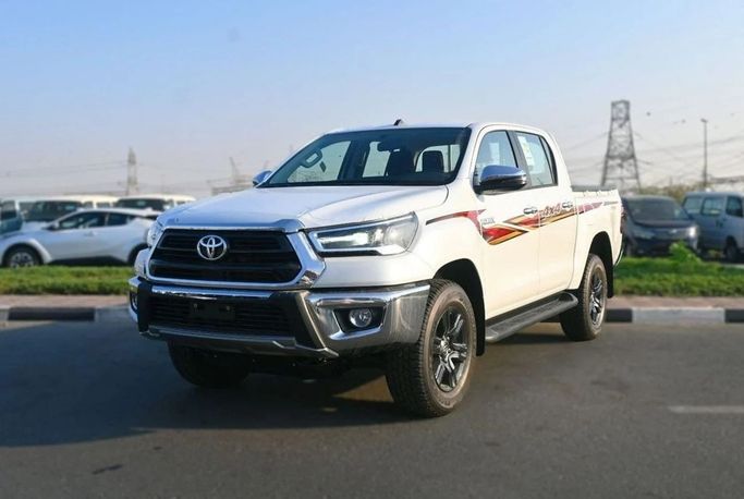 Новый Toyota Hilux VIII Рестайлинг, 2.7 л, 2025 в ОАЭ, Дубай от Hussein Ghulam Motors FZCO Белый цвет. GCC | AUTO.AE | Объявление #278393