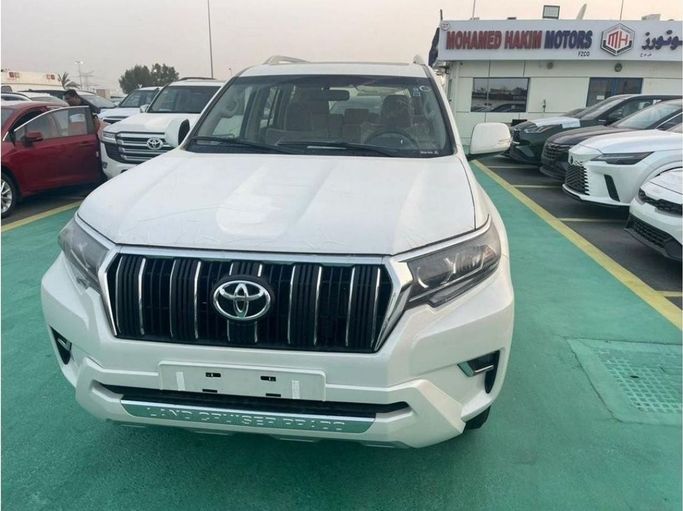 New Toyota Land Cruiser Prado 150 Series Facelift 3, 2.7 l, 2023 in Dubai by Mohamed Hakim Motors, White color. GCC Specs | AUTO.AE