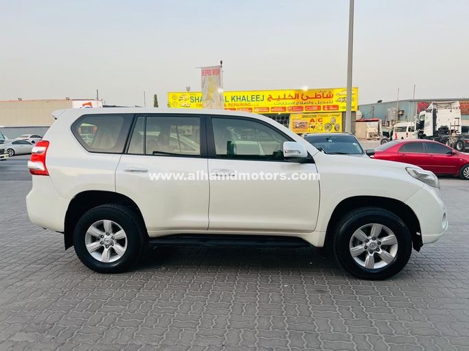 Used Toyota Land Cruiser Prado 150 Series Facelift 1, 2.7 l, 2015 in Dubai by Alhamd Motors, White color. GCC Specs | AUTO.AE