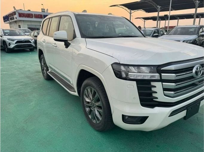 New Toyota Land Cruiser 300 Series, 3.3 l, 2023 in Dubai by Mohamed Hakim Motors, White color. GCC Specs | AUTO.AE