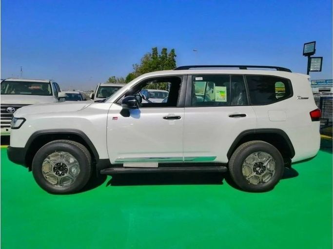 New Toyota Land Cruiser 300 Series, 3.4 l, 2023 in Dubai by Mohamed Hakim Motors, White color. GCC Specs | AUTO.AE