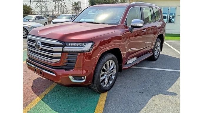 New Toyota Land Cruiser 300 Series, 3.3 l, 2023 in Dubai by Mohamed Hakim Motors, Red color. GCC Specs | AUTO.AE