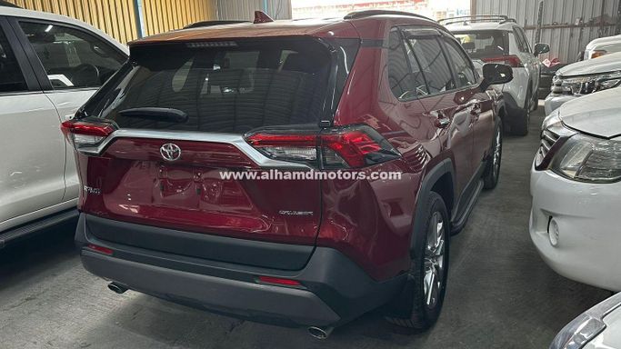 Used Toyota RAV4 V (XA50), 2.5 l, 2021 in Dubai by Alhamd Motors, Red color. Other | AUTO.AE