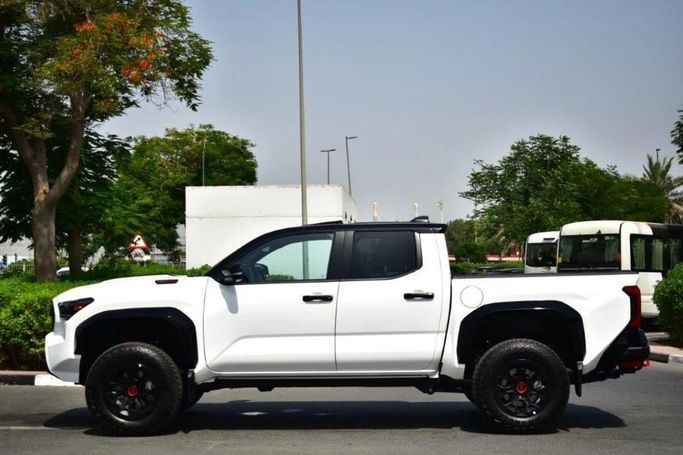 New Toyota Tacoma IV, 2.4 l, 2025 in Dubai by World Center Motors FZE, White color. Canadian Specs | AUTO.AE