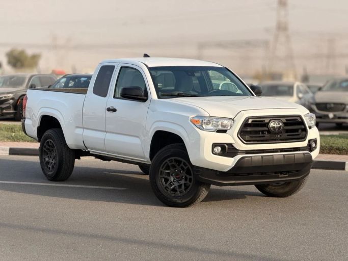 Used Toyota Tacoma III, 2.7 l, 2019 in Dubai by GHAZNI MOTORS, White color. American Specs | AUTO.AE