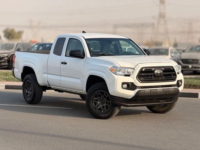 Used Toyota Tacoma III, 2.7 l, 2019 in Dubai by GHAZNI MOTORS, White color. American Specs | AUTO.AE | Listing #259138